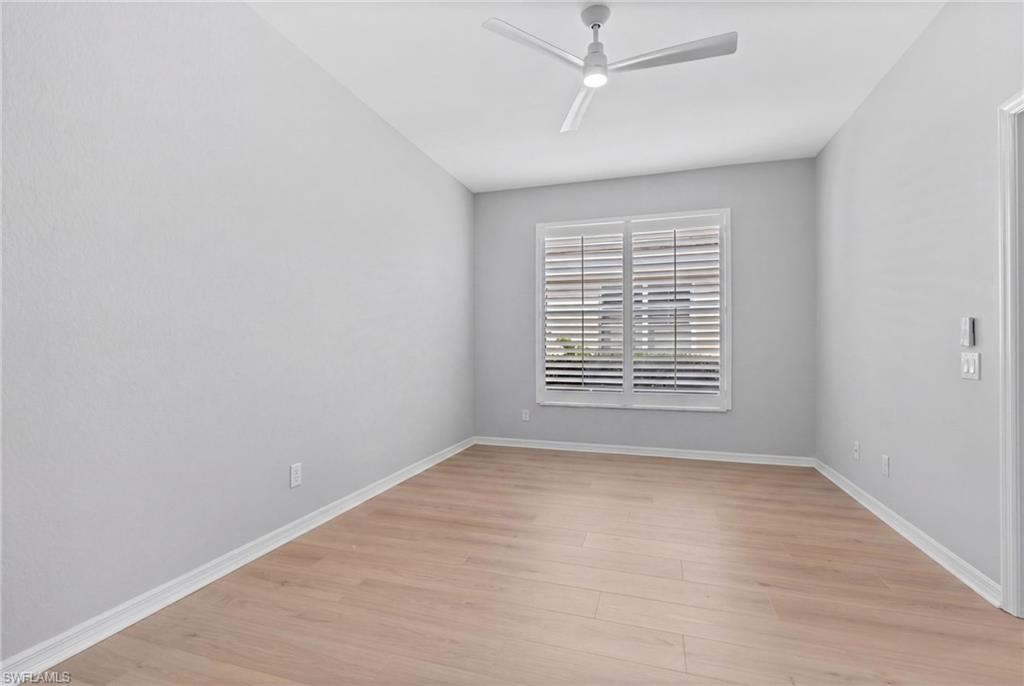 1717 Winding Oaks Way Naples, FL 34109 - Photo 22 of 29 a view of an empty room with a window