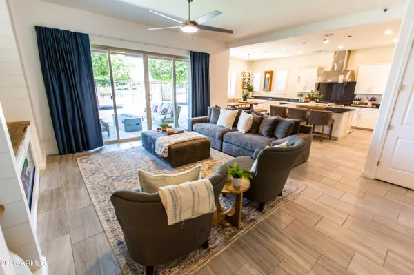 a kitchen with stainless steel appliances kitchen island granite countertop a stove and a refrigerator