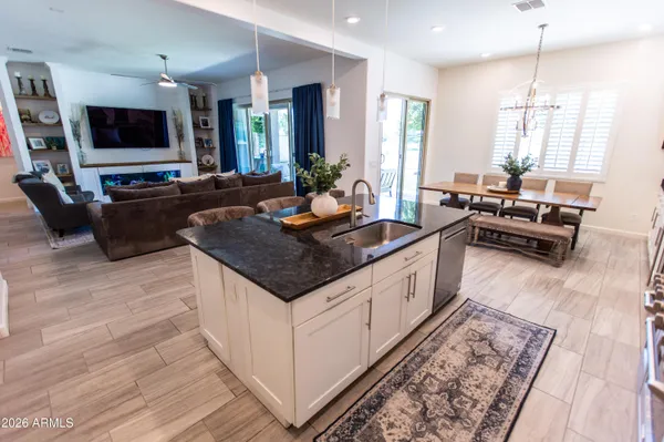 a living room with couches and a flat screen tv