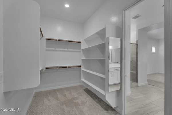 a bathroom with a granite countertop sink a toilet and bathtub