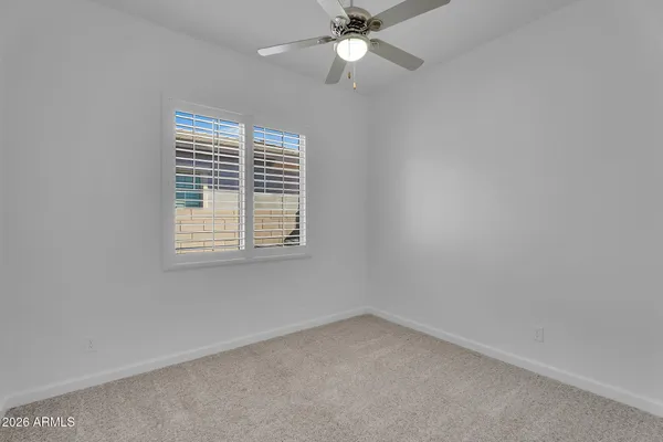 a view of a backyard with sitting area
