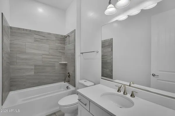 a view of a lake with a yard and potted plants