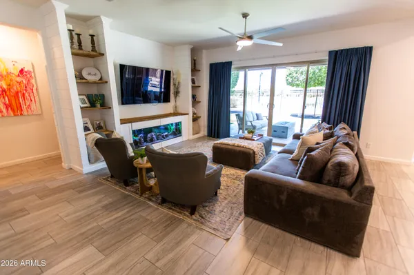 a large kitchen with stainless steel appliances kitchen island granite countertop a sink and cabinets