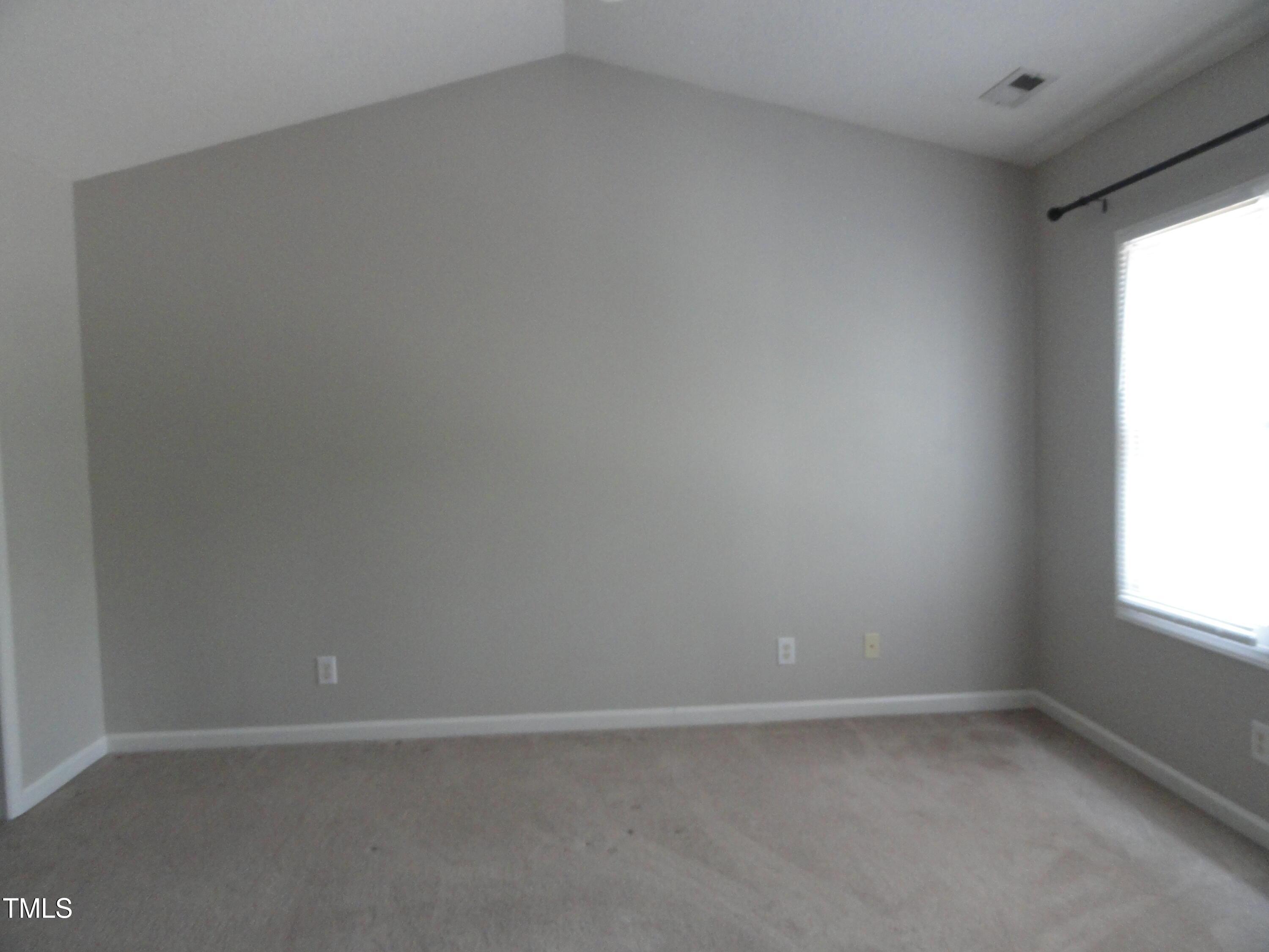 201 Union Mills Way Cary, NC 27519 - Photo 13 of 15 a view of an empty room with a window