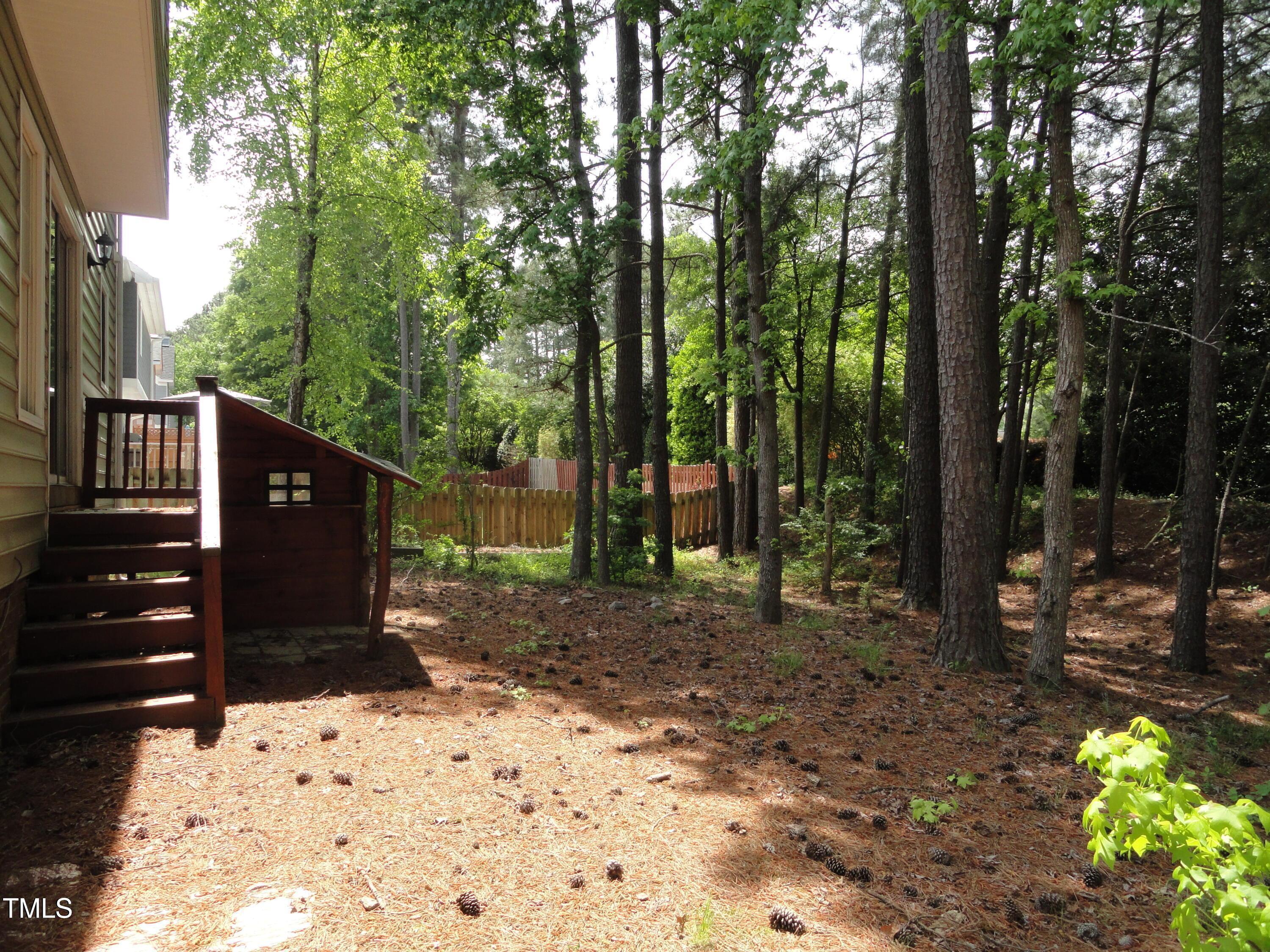 201 Union Mills Way Cary, NC 27519 - Photo 14 of 15 a view of a backyard with trees