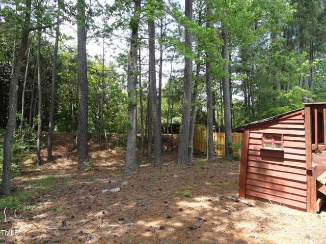 a backyard of a house with lots of green space