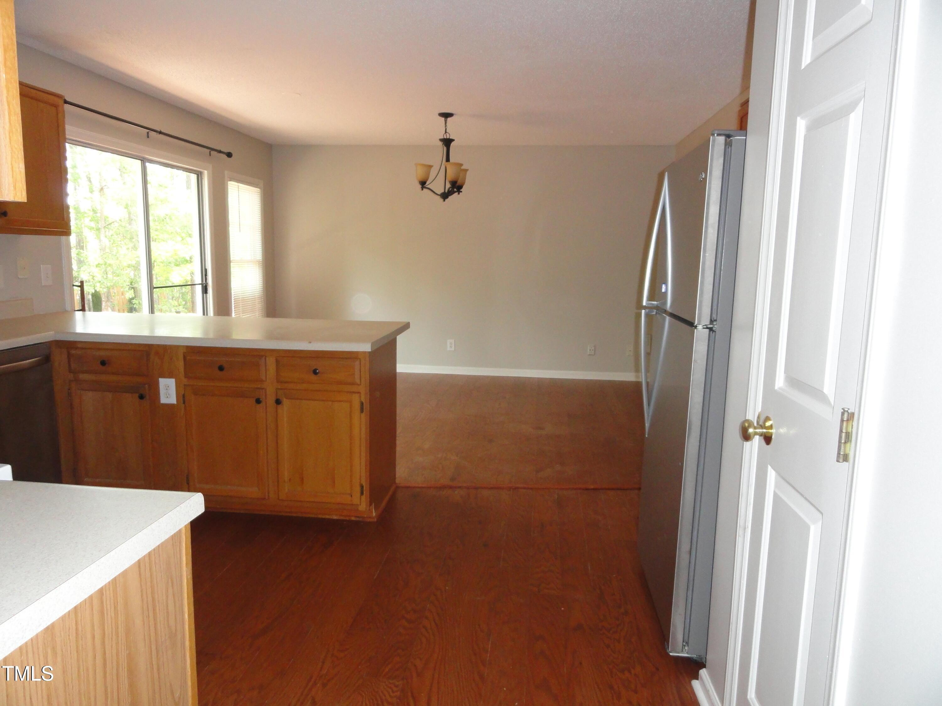 201 Union Mills Way Cary, NC 27519 - Photo 2 of 15 a bathroom with a double vanity sink a mirror and a bathtub