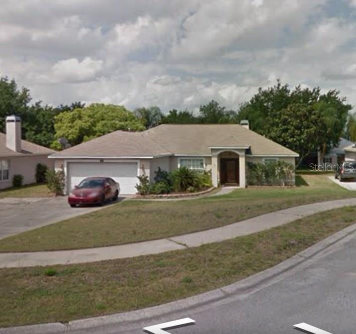 1025 High Ridge Court Clermont, FL 34715 - Photo 1 of 1 a aerial view of a house next to a yard and road