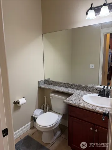 a bedroom with a bed and dresser