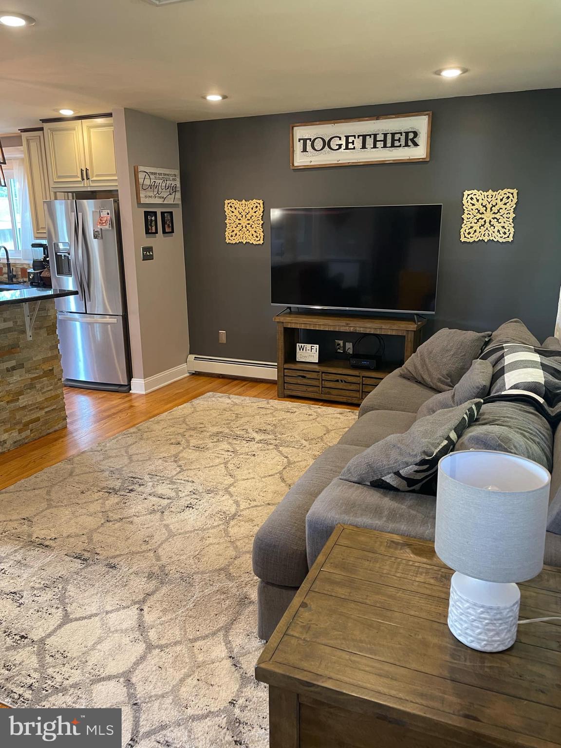 314 Willow Road Hellertown, PA 18055 - Photo 4 of 25 a living room with furniture and a flat screen tv