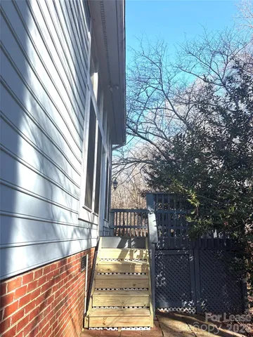 a view of a pathway with a backyard