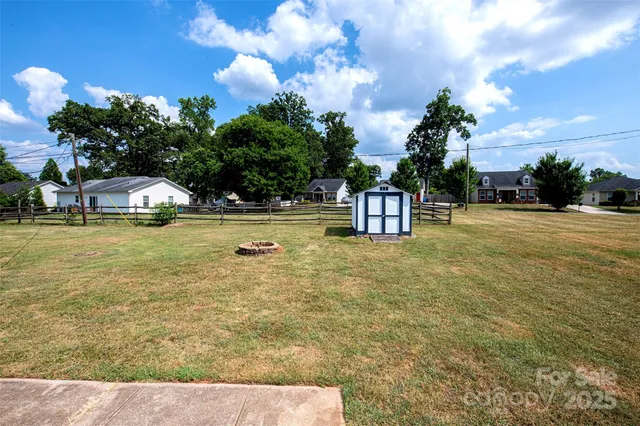 a front view of house with swimming pool having outdoor seating