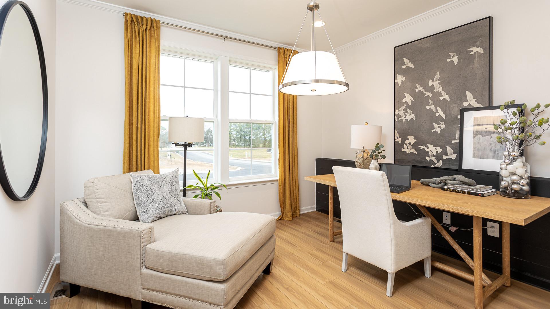 Tbb Monocacy Crossing Parkway, Unit REGENT Brunswick, MD 21716 - Photo 11 of 40 a living room with furniture a table and a chandelier