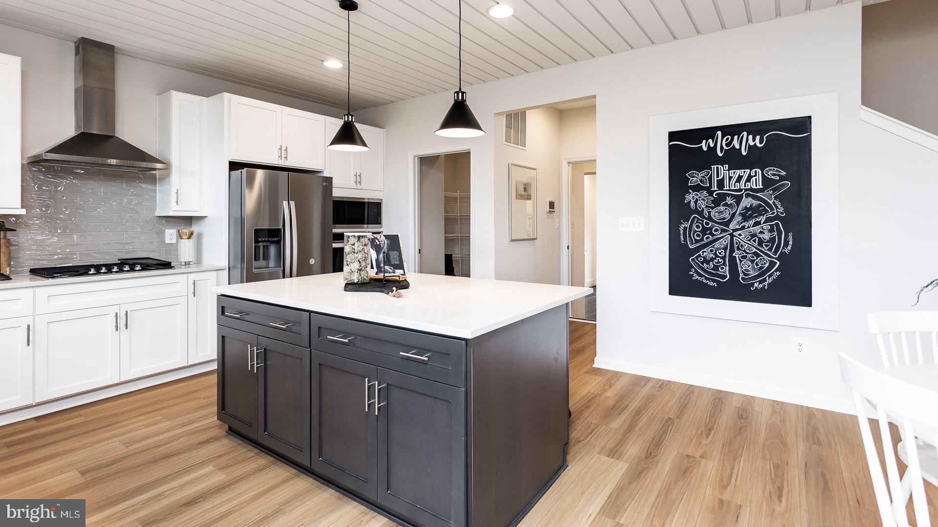 Tbb Monocacy Crossing Parkway, Unit REGENT Brunswick, MD 21716 - Photo 3 of 40 a kitchen with stainless steel appliances granite countertop a sink and a stove