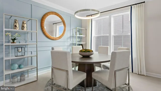 a view of a dining room with furniture and a window