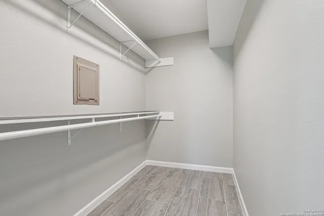 a view of a room with wooden floor