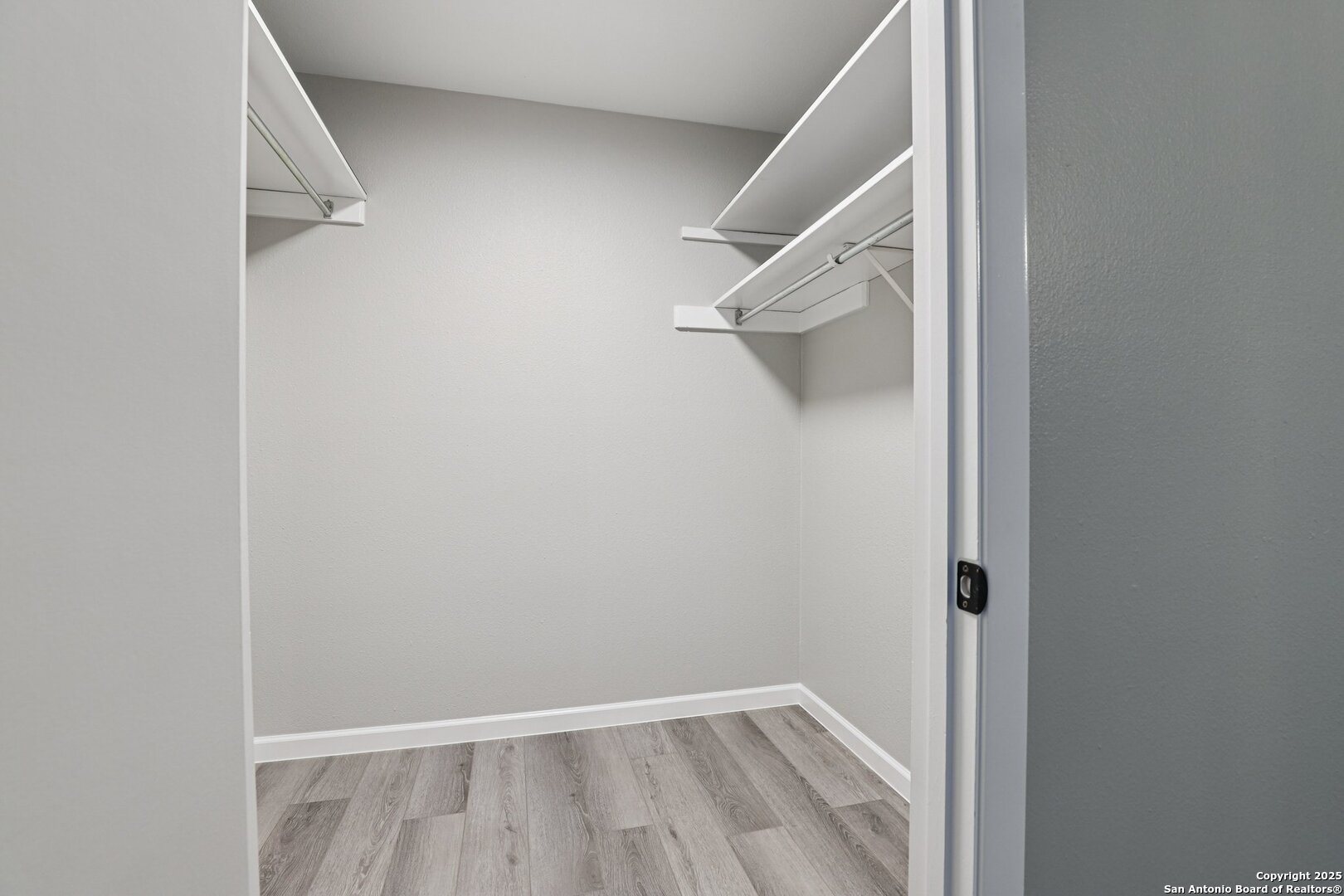 3441 Turtle Village Drive, Unit 92FF San Antonio, TX 78230 - Photo 23 of 34 a view of walk in closet with empty racks