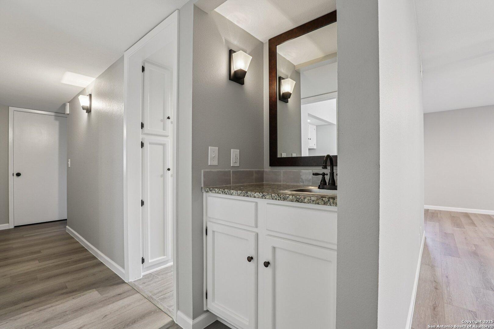 3441 Turtle Village Drive, Unit 92FF San Antonio, TX 78230 - Photo 26 of 34 a bathroom with a granite countertop sink and a mirror