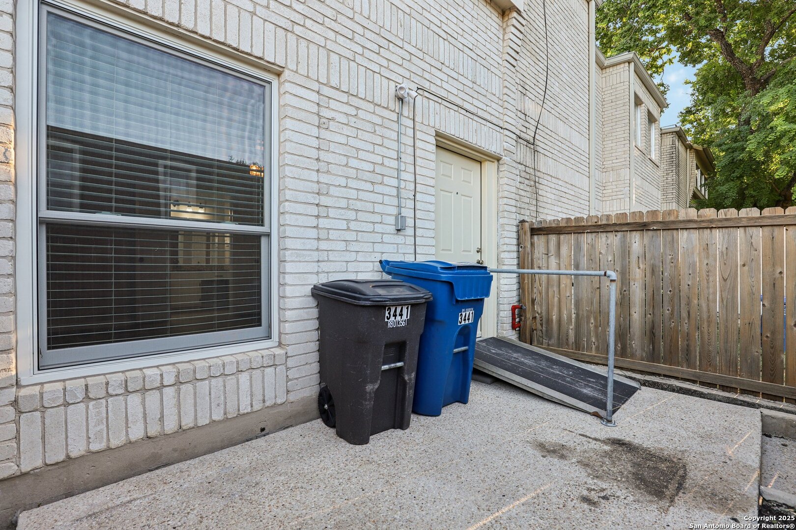 3441 Turtle Village Drive, Unit 92FF San Antonio, TX 78230 - Photo 28 of 34 a view of a house with wooden fence