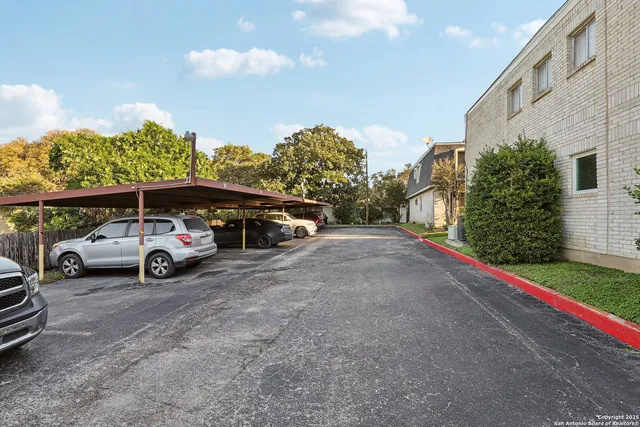a view of parking with cars parked