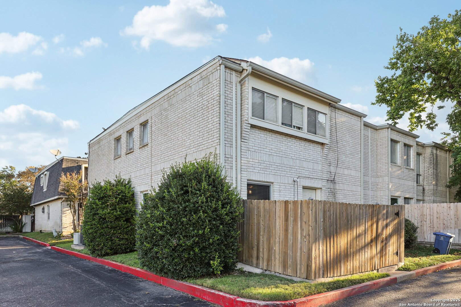 3441 Turtle Village Drive, Unit 92FF San Antonio, TX 78230 - Photo 31 of 34 a view of a back yard of the house