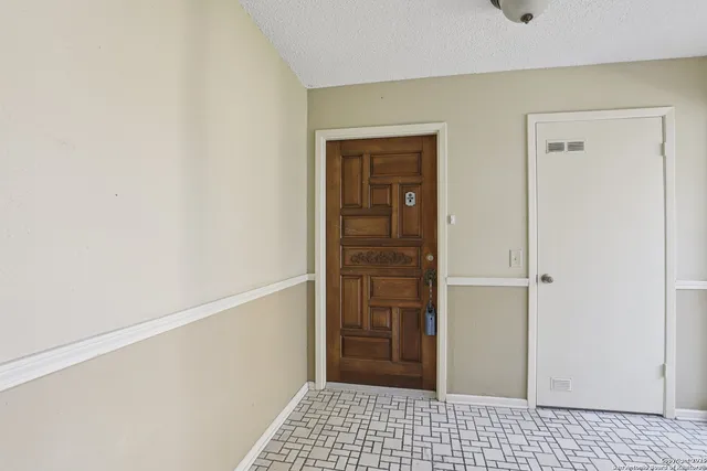 a view of a closet area with rug