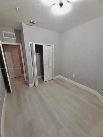 an empty room with a fireplace