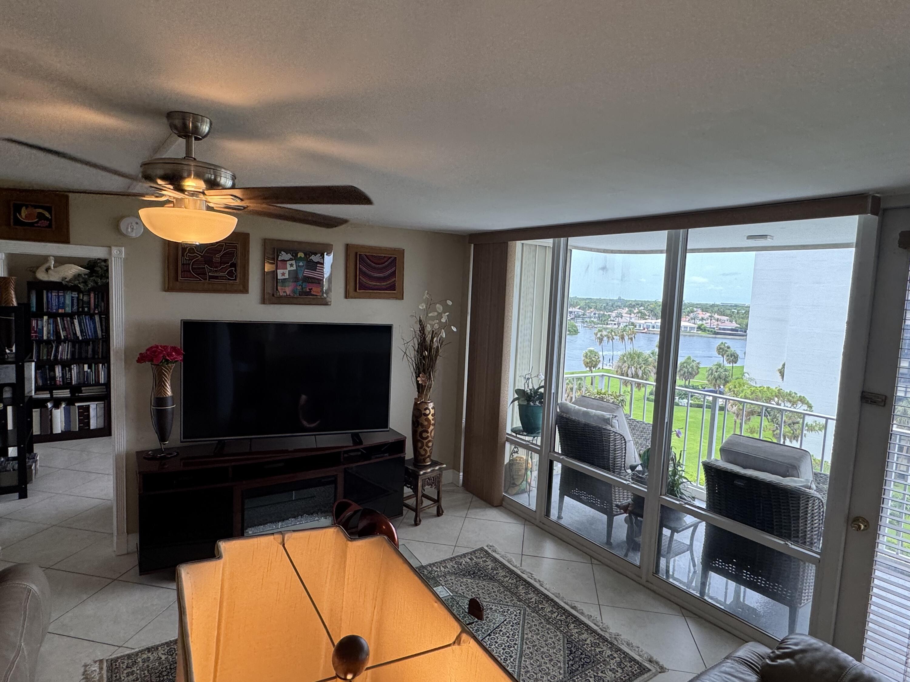 336 Golfview Road, Unit 706 North Palm Beach, FL 33408 - Photo 12 of 41 a living room with furniture and a fireplace
