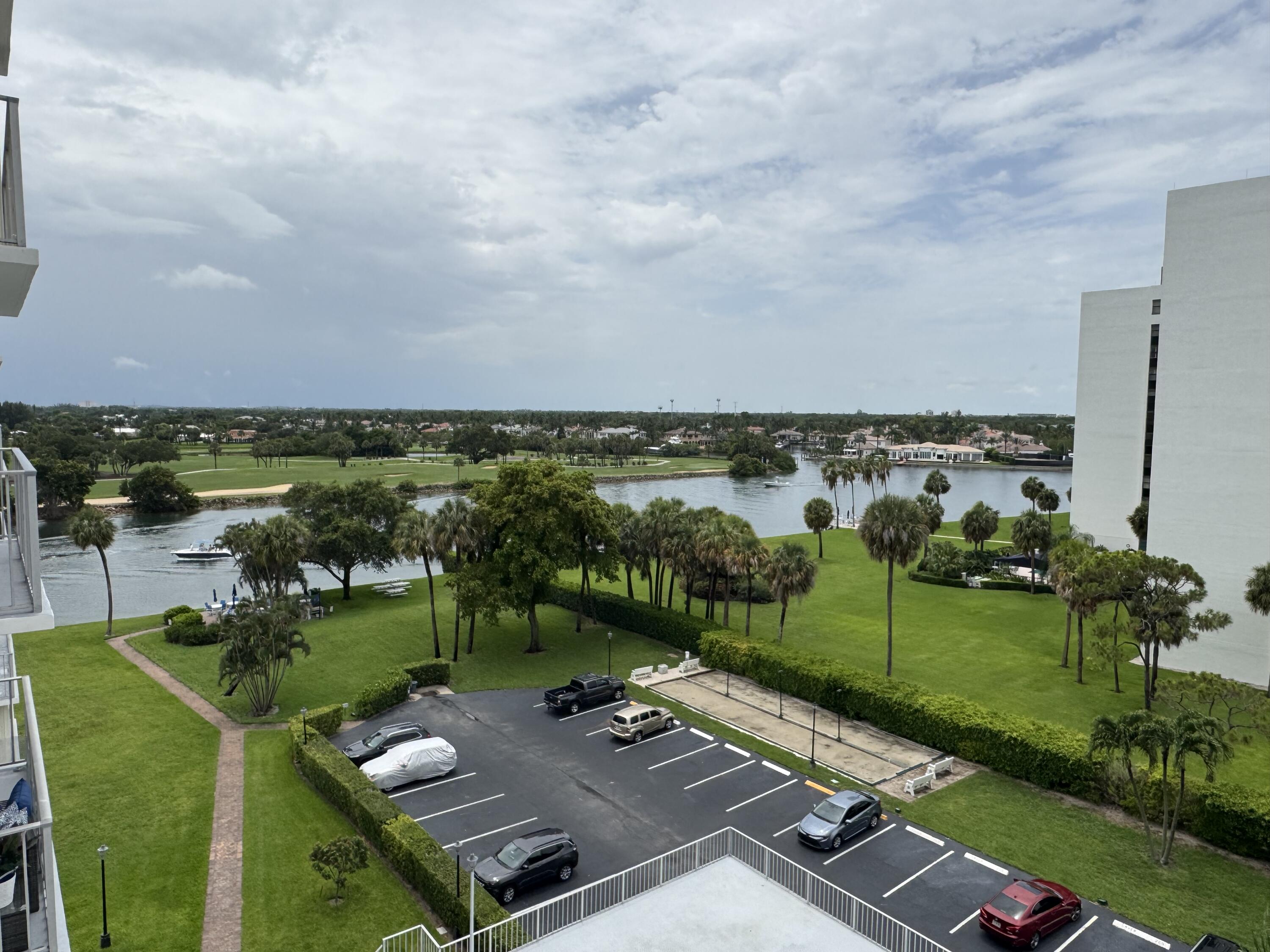 336 Golfview Road, Unit 706 North Palm Beach, FL 33408 - Photo 13 of 41 a view of a lake with a yard
