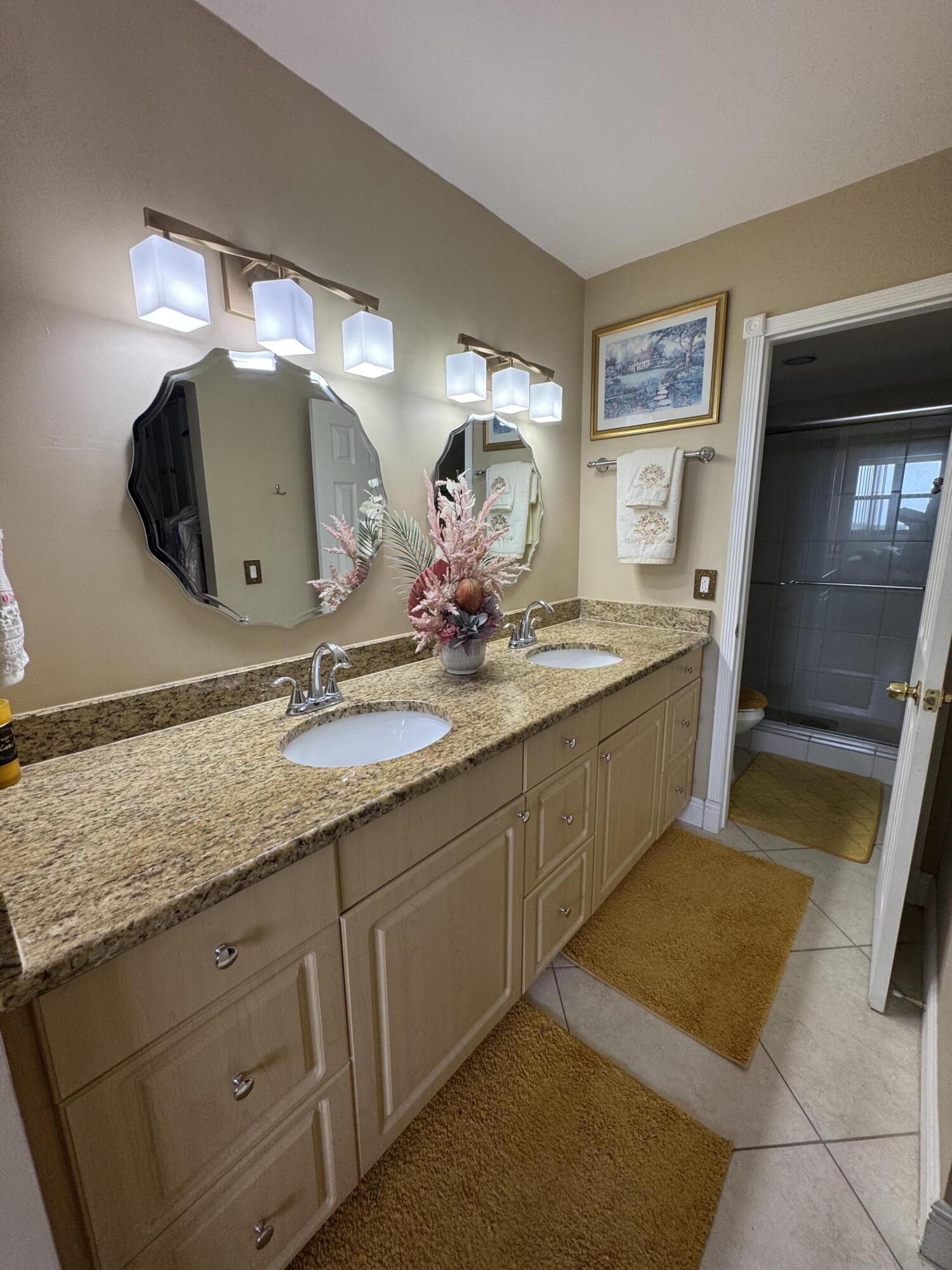 336 Golfview Road, Unit 706 North Palm Beach, FL 33408 - Photo 18 of 41 a bathroom with a sink and a mirror