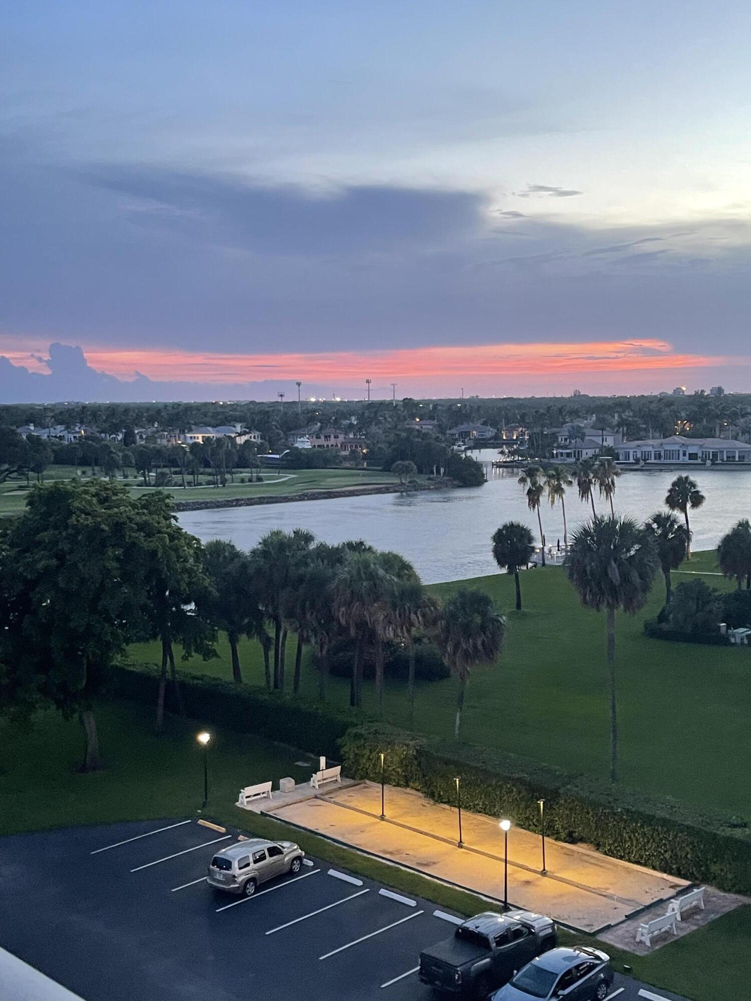 336 Golfview Road, Unit 706 North Palm Beach, FL 33408 - Photo 2 of 41 a view of a lake with a city