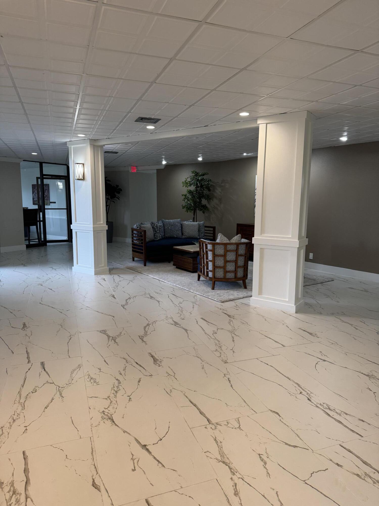 336 Golfview Road, Unit 706 North Palm Beach, FL 33408 - Photo 26 of 41 an outdoor space with chairs