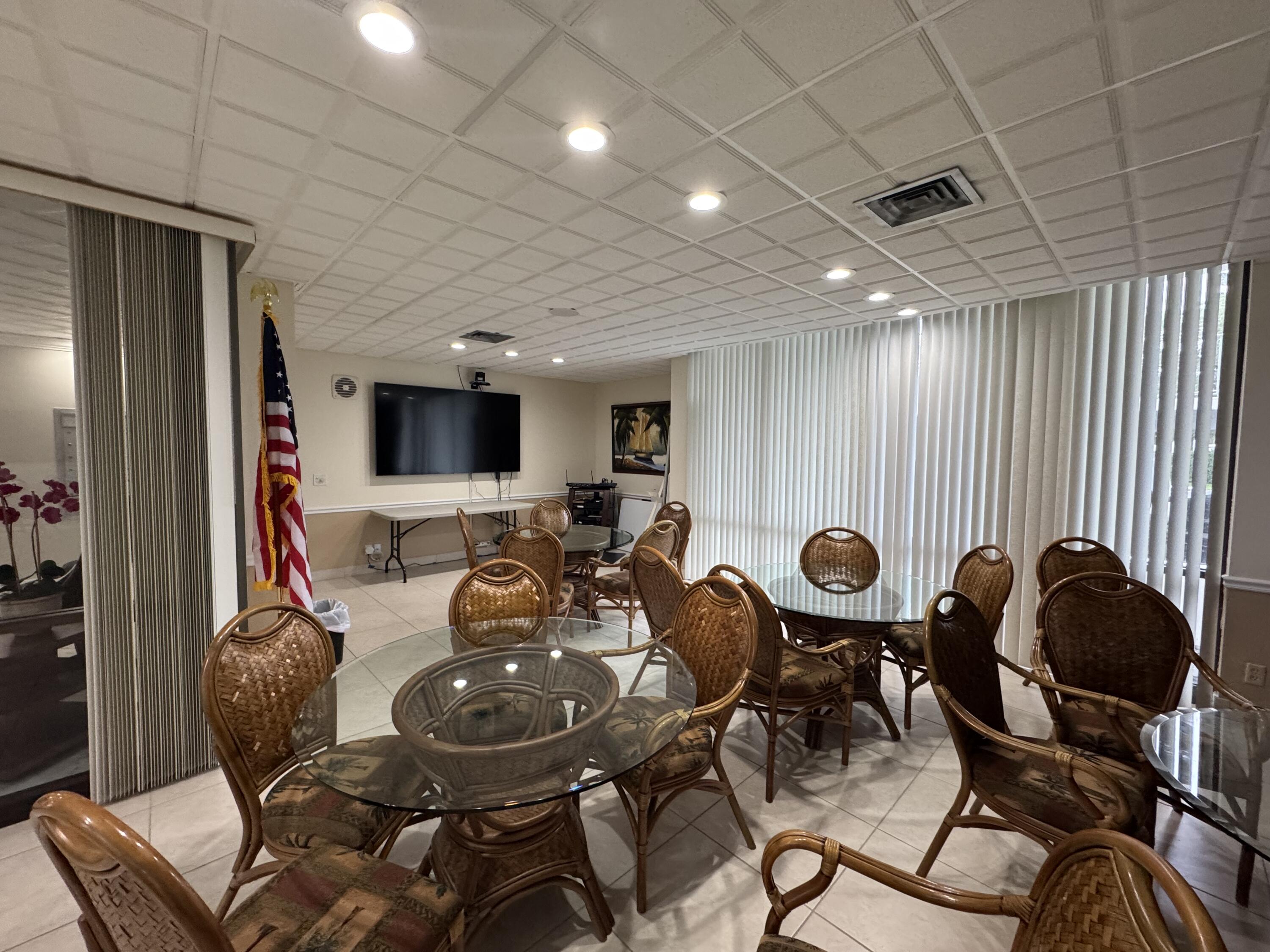 336 Golfview Road, Unit 706 North Palm Beach, FL 33408 - Photo 31 of 41 a view of a dining room with furniture and chandelier