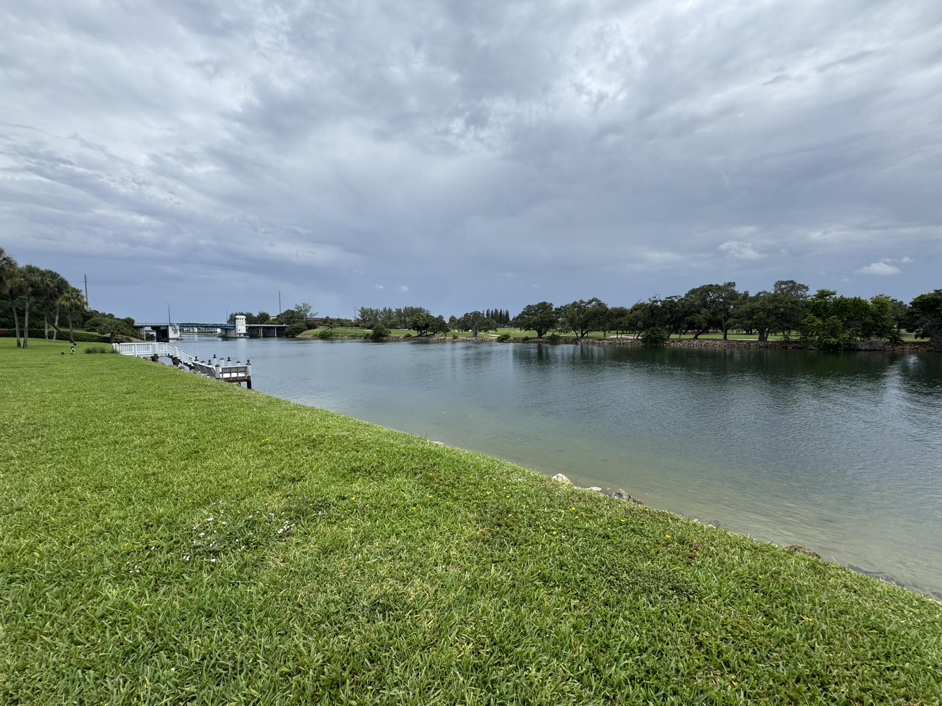 336 Golfview Road, Unit 706 North Palm Beach, FL 33408 - Photo 38 of 41 a view of a lake with houses in the back