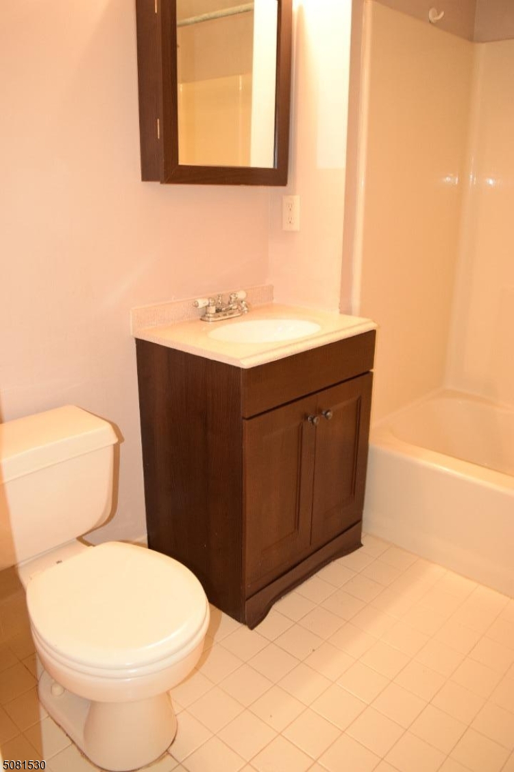 177 Riveredge Drive Chatham, NJ 07928 - Photo 13 of 17 a bathroom with a sink vanity mirror and toilet