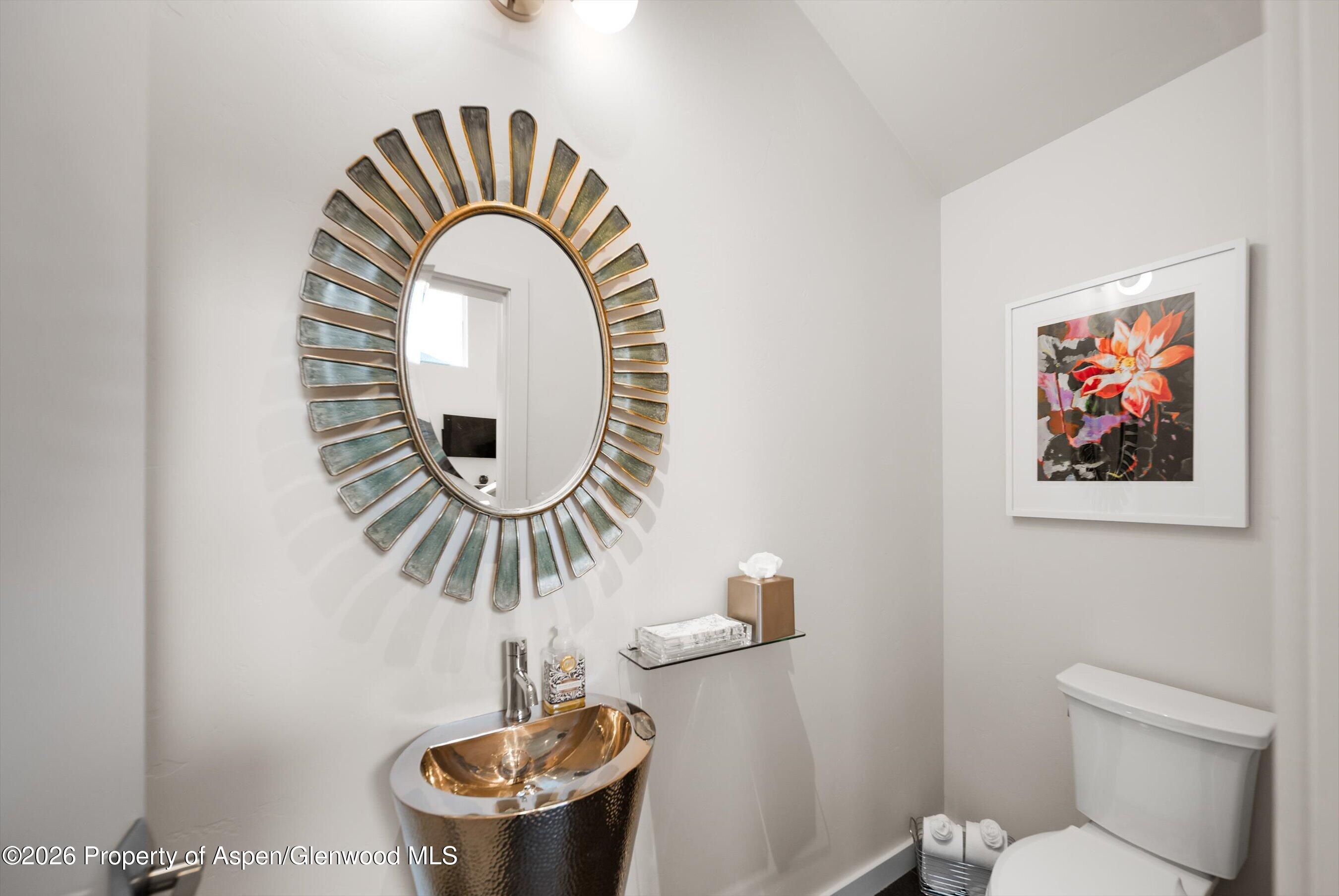 350 Sopris Circle Basalt, CO 81621 - Photo 16 of 49 a close view of a sink a mirror and a toilet