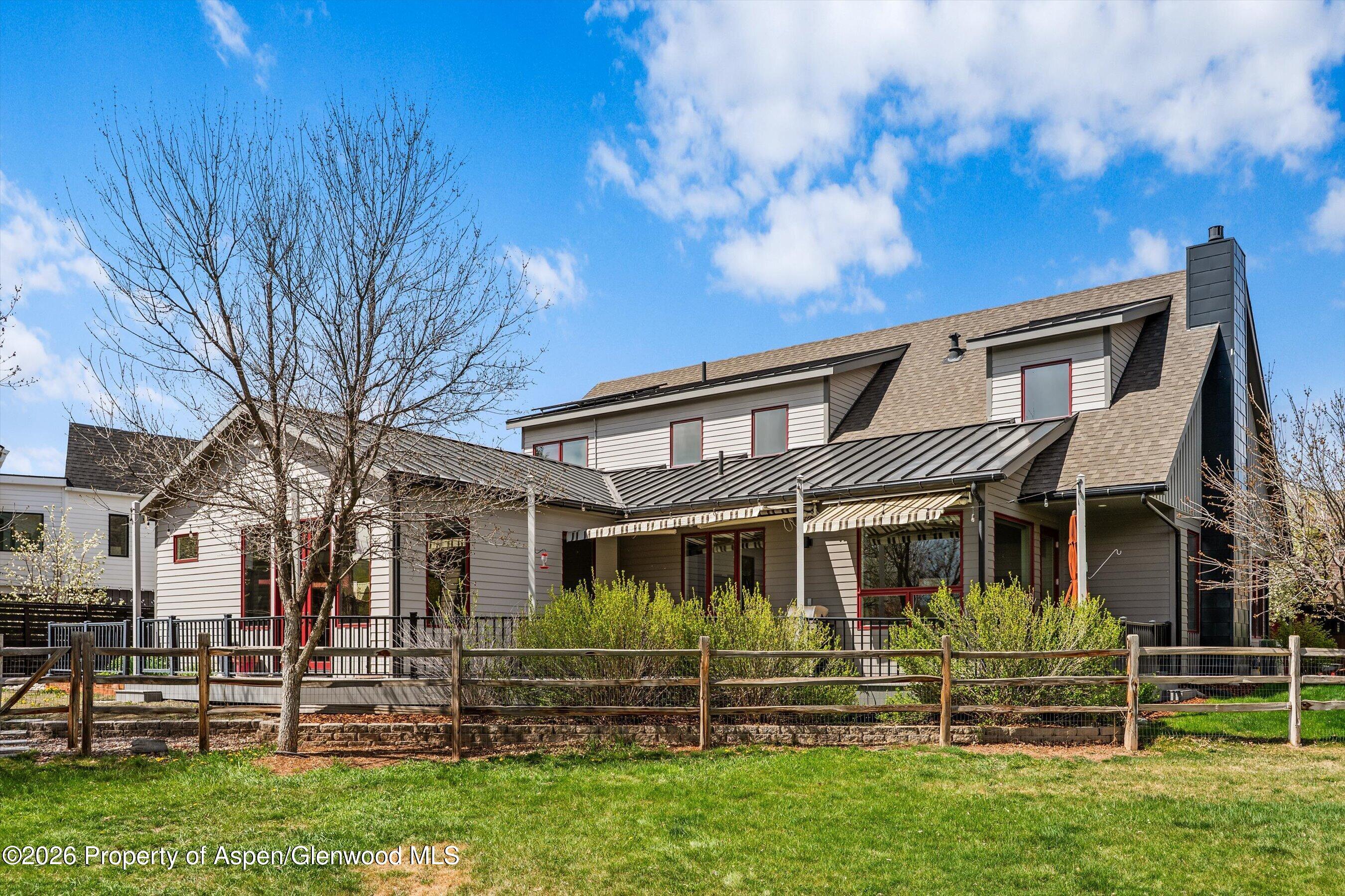 350 Sopris Circle Basalt, CO 81621 - Photo 2 of 49 a front view of a house with a garden