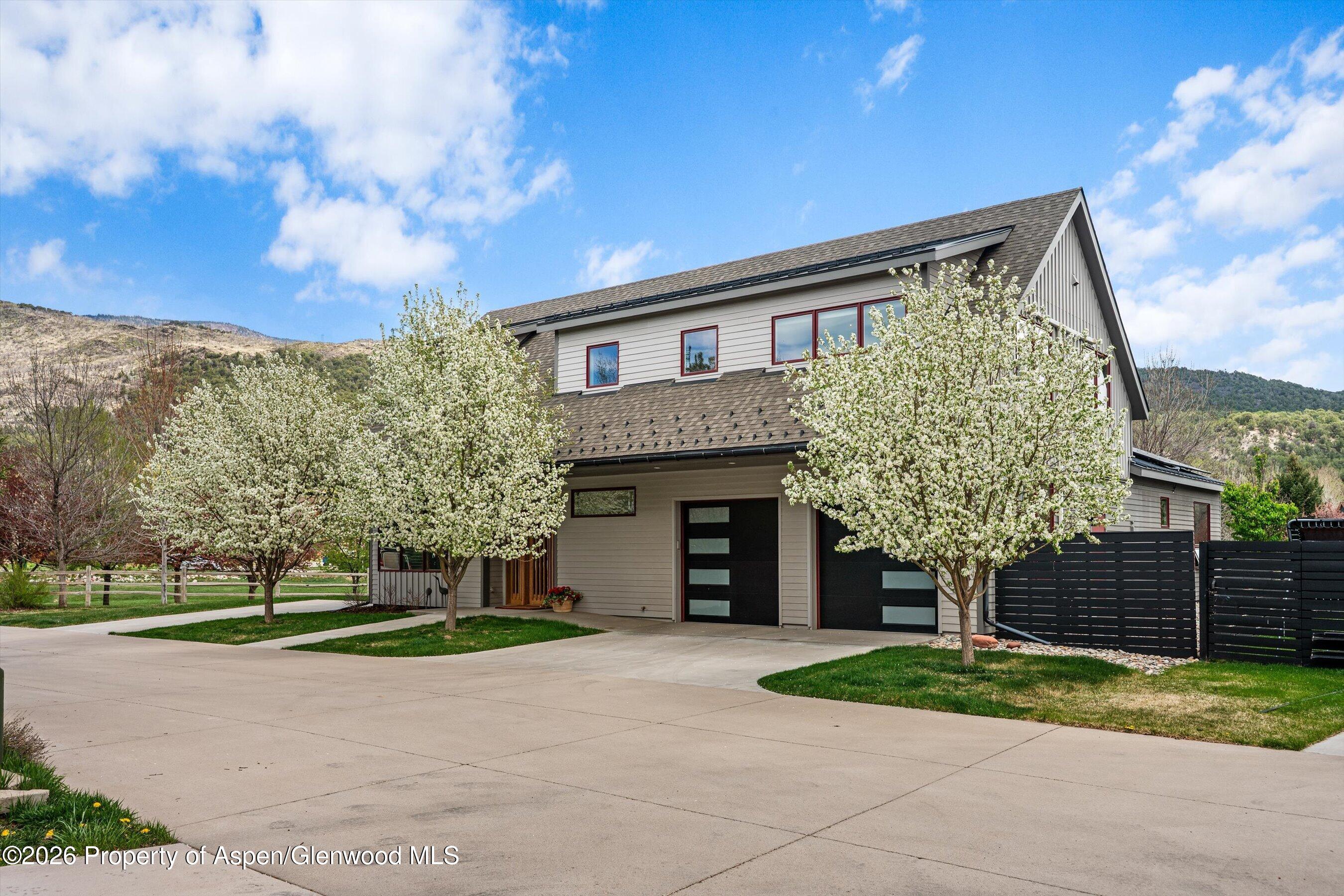 350 Sopris Circle Basalt, CO 81621 - Photo 28 of 49 a front view of a house with a garden and trees