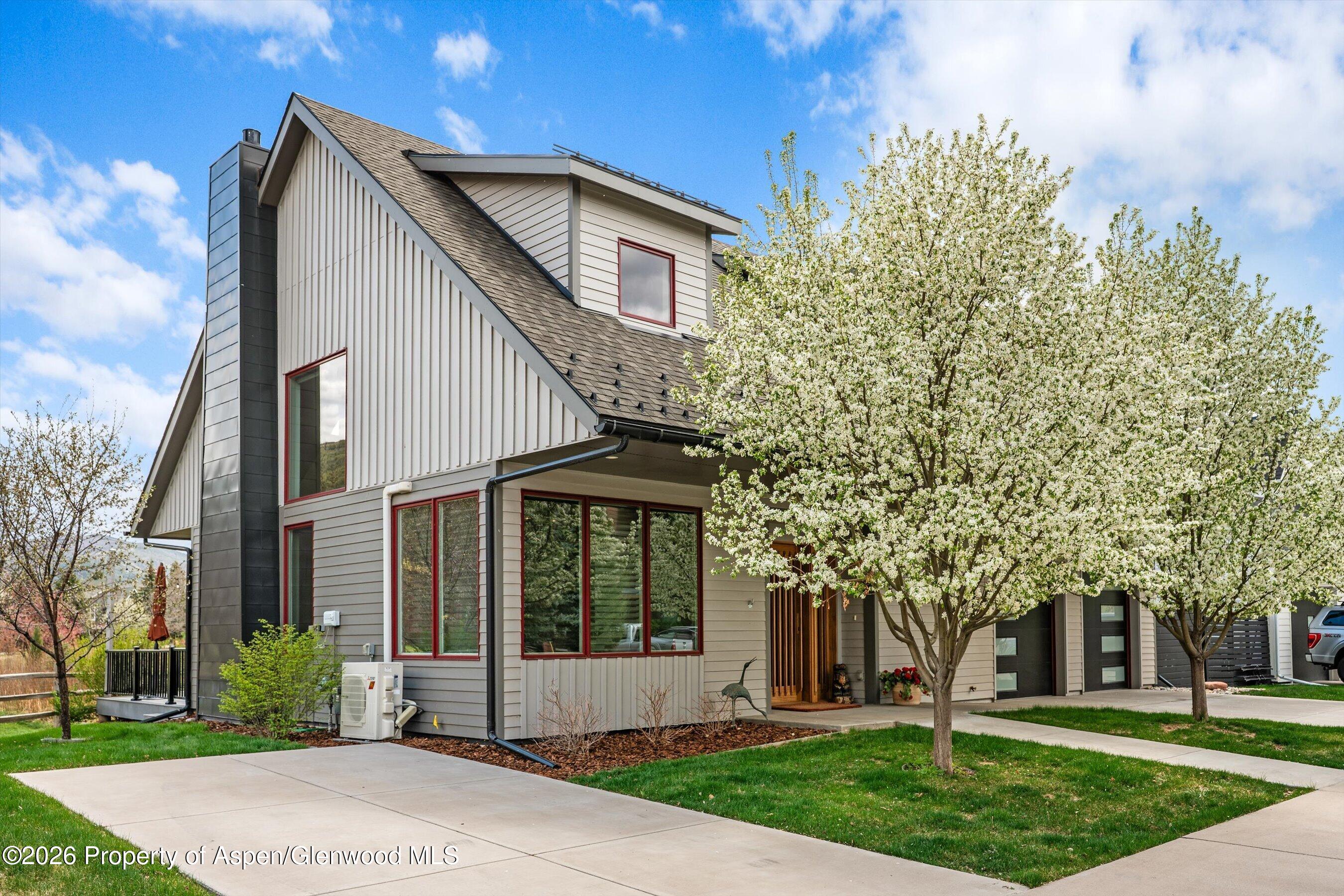 350 Sopris Circle Basalt, CO 81621 - Photo 29 of 49 a front view of a house with a garden and trees