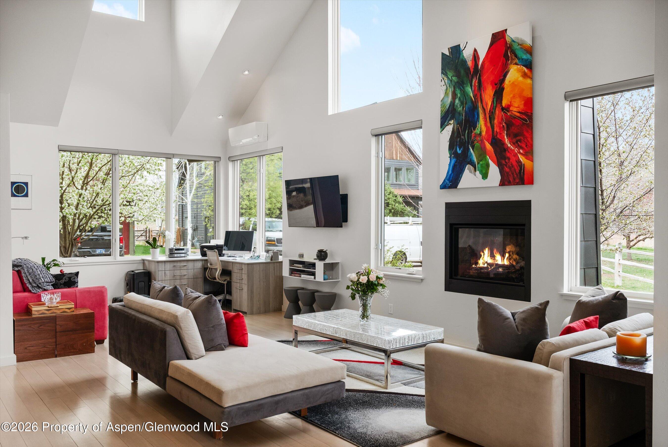 350 Sopris Circle Basalt, CO 81621 - Photo 4 of 49 a living room with furniture fireplace and a large window