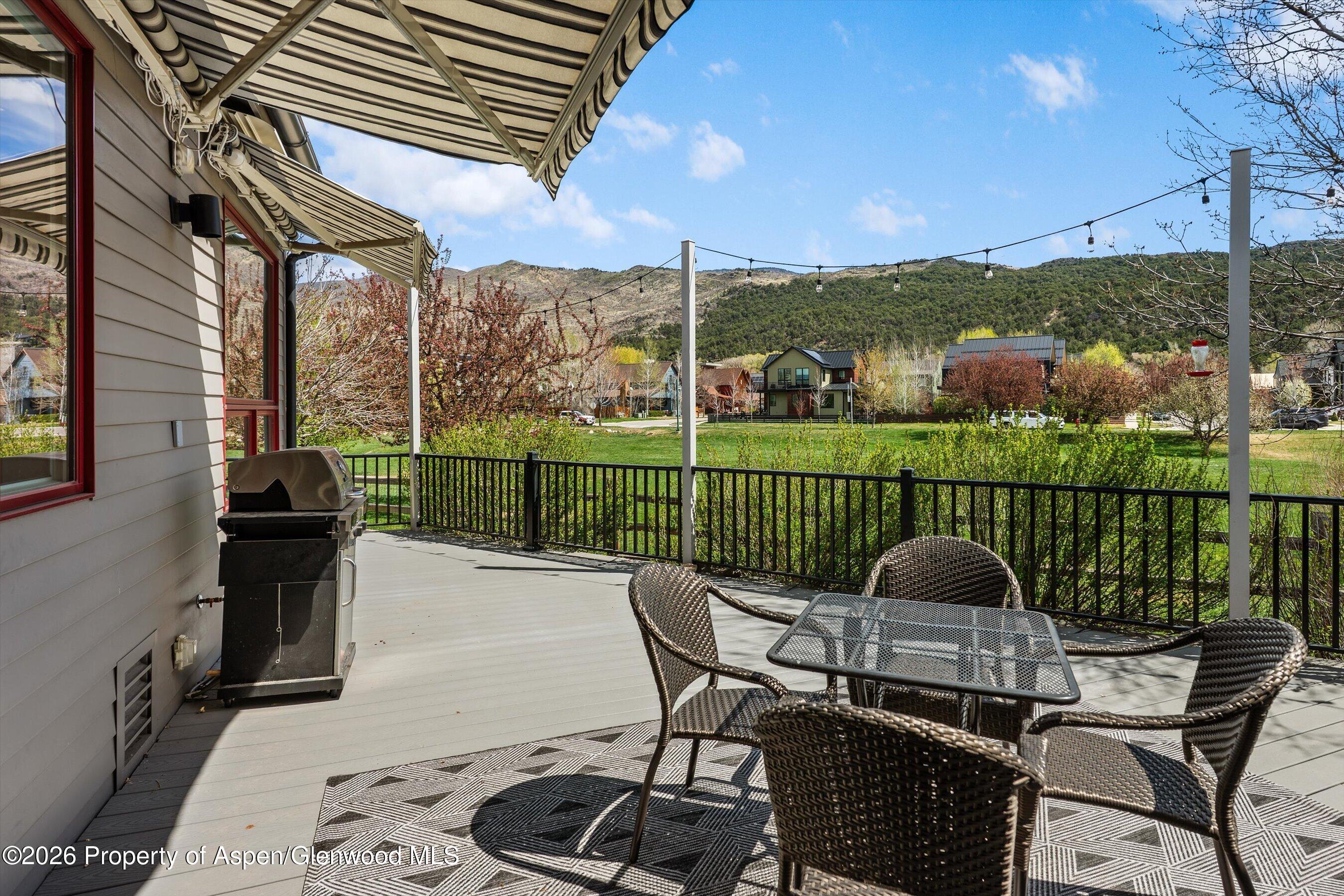350 Sopris Circle Basalt, CO 81621 - Photo 41 of 49 a view of a chairs and table in patio with a lake view