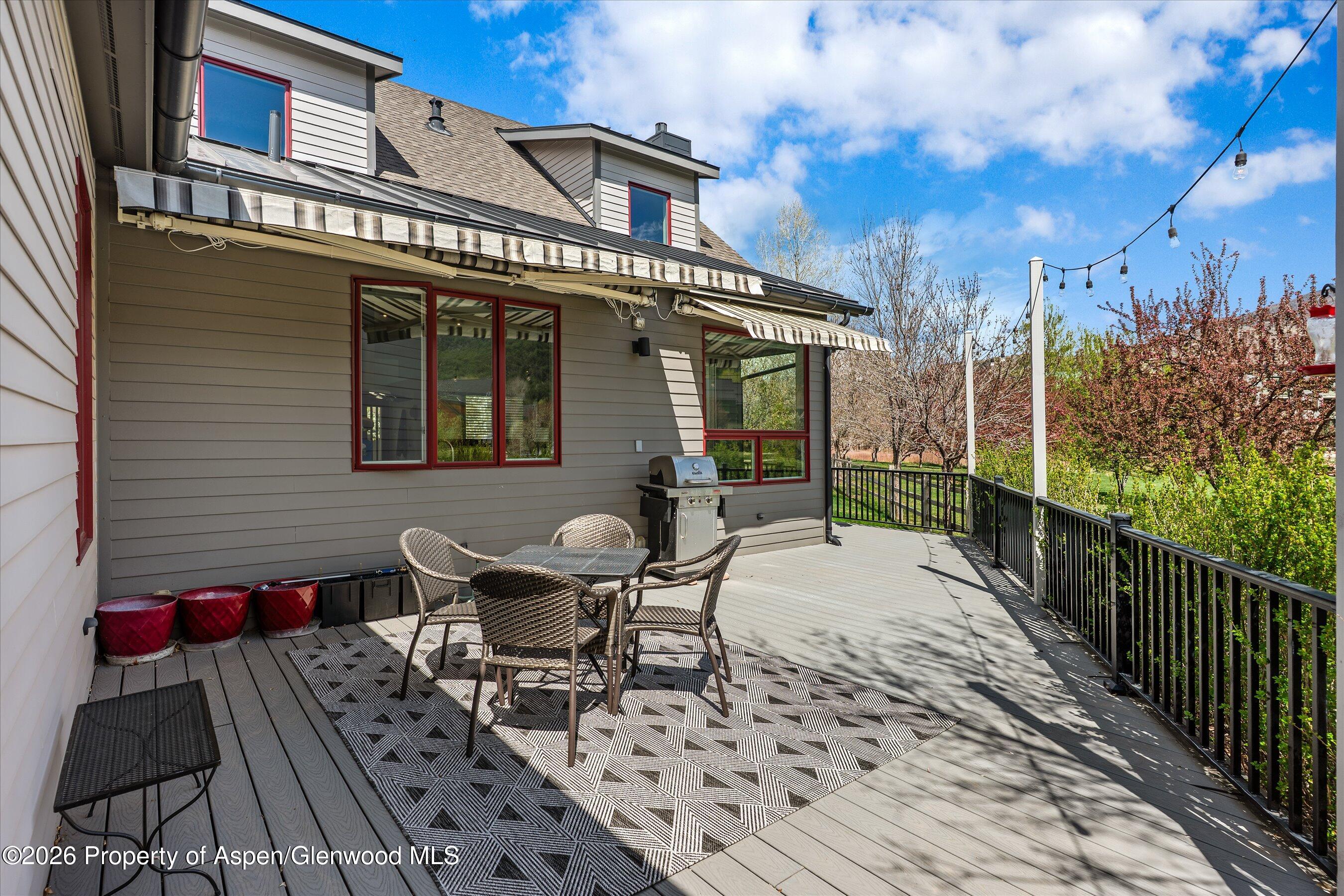350 Sopris Circle Basalt, CO 81621 - Photo 42 of 49 a view of a patio with table and chairs and wooden floor
