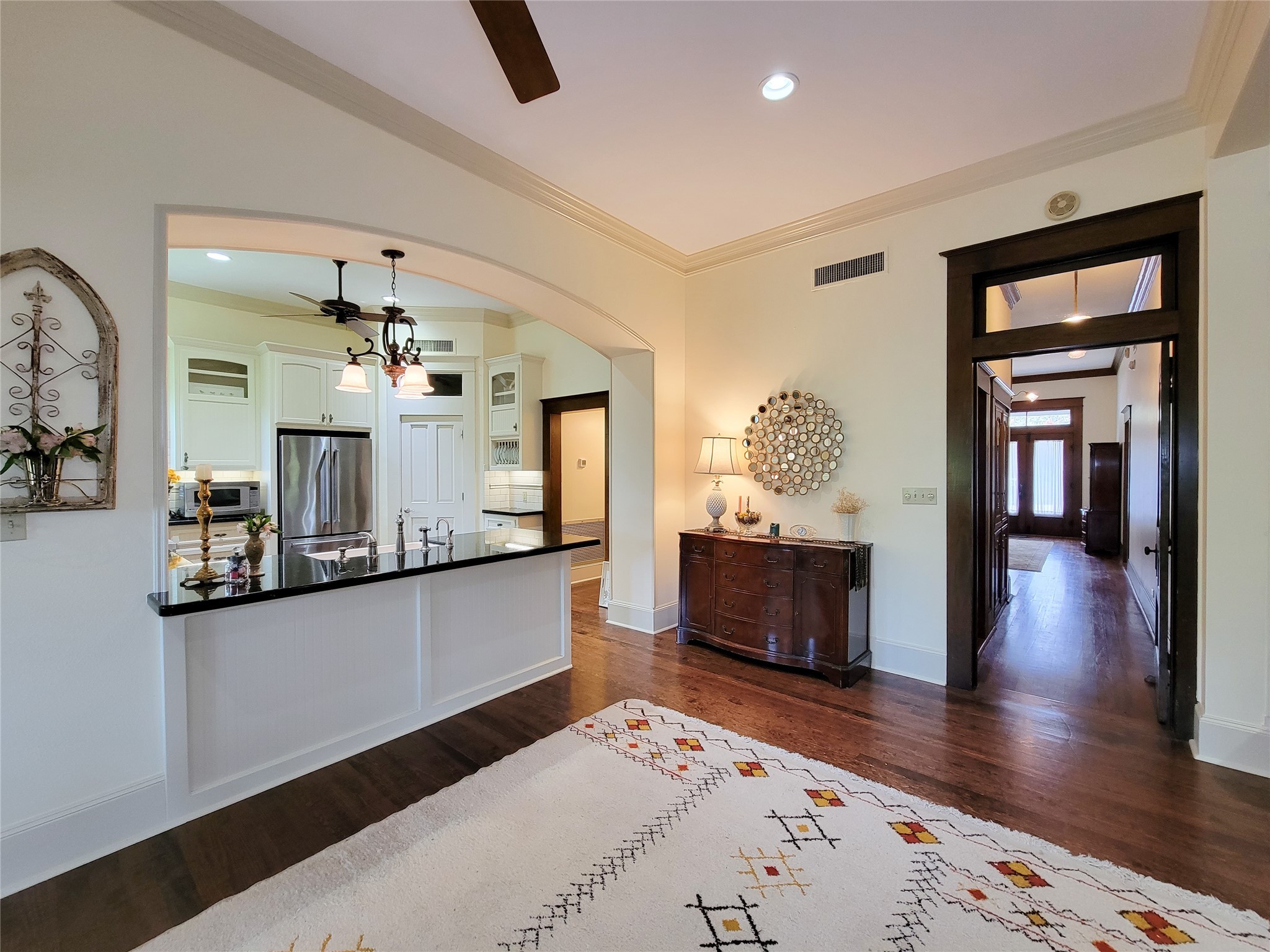 1406 Key Street Brenham, TX 77833 - Photo 13 of 50 a living room with stainless steel appliances kitchen island granite countertop furniture a fireplace and wooden floor