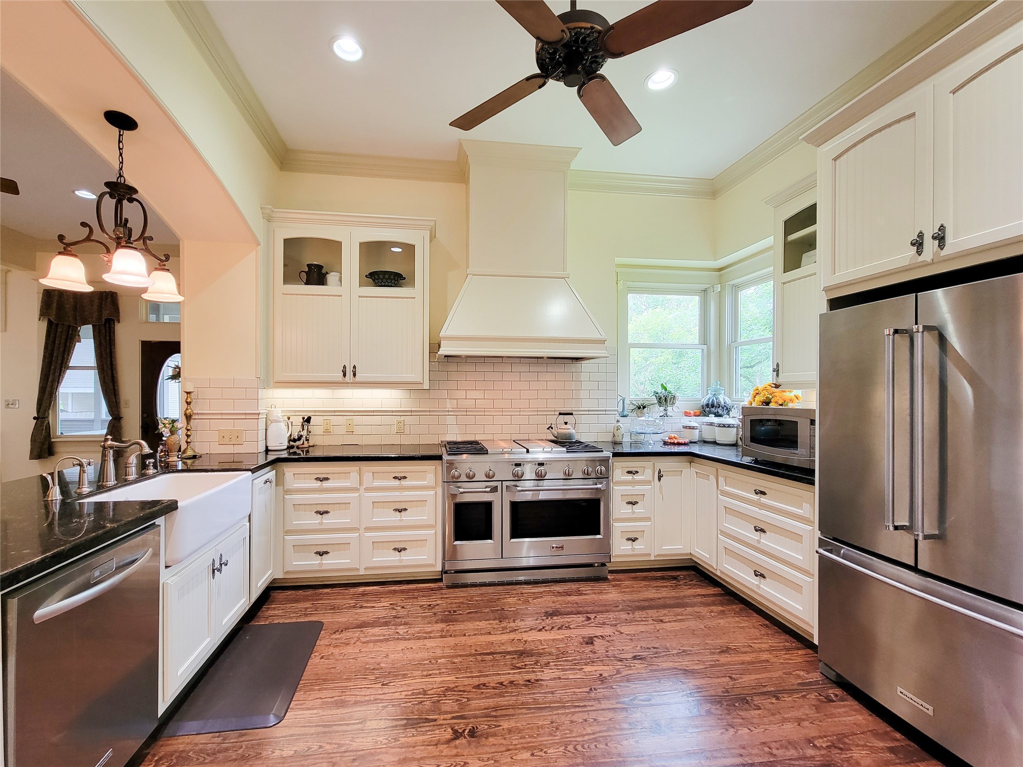 1406 Key Street Brenham, TX 77833 - Photo 18 of 50 a kitchen with granite countertop a sink stainless steel appliances and counter space