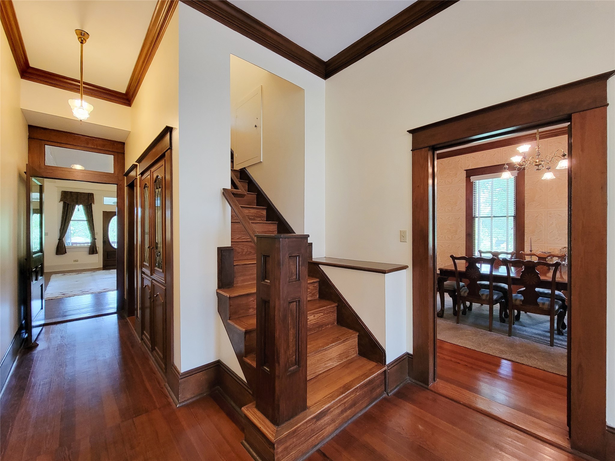 1406 Key Street Brenham, TX 77833 - Photo 22 of 50 a view of a hallway with wooden floor and stairs