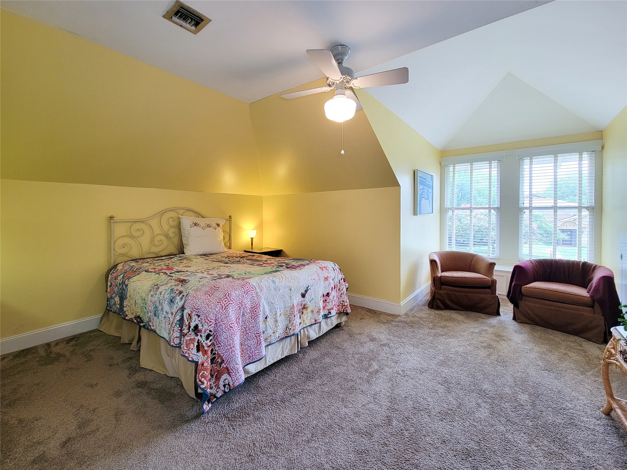 1406 Key Street Brenham, TX 77833 - Photo 26 of 50 a spacious bedroom with a bed and a couch