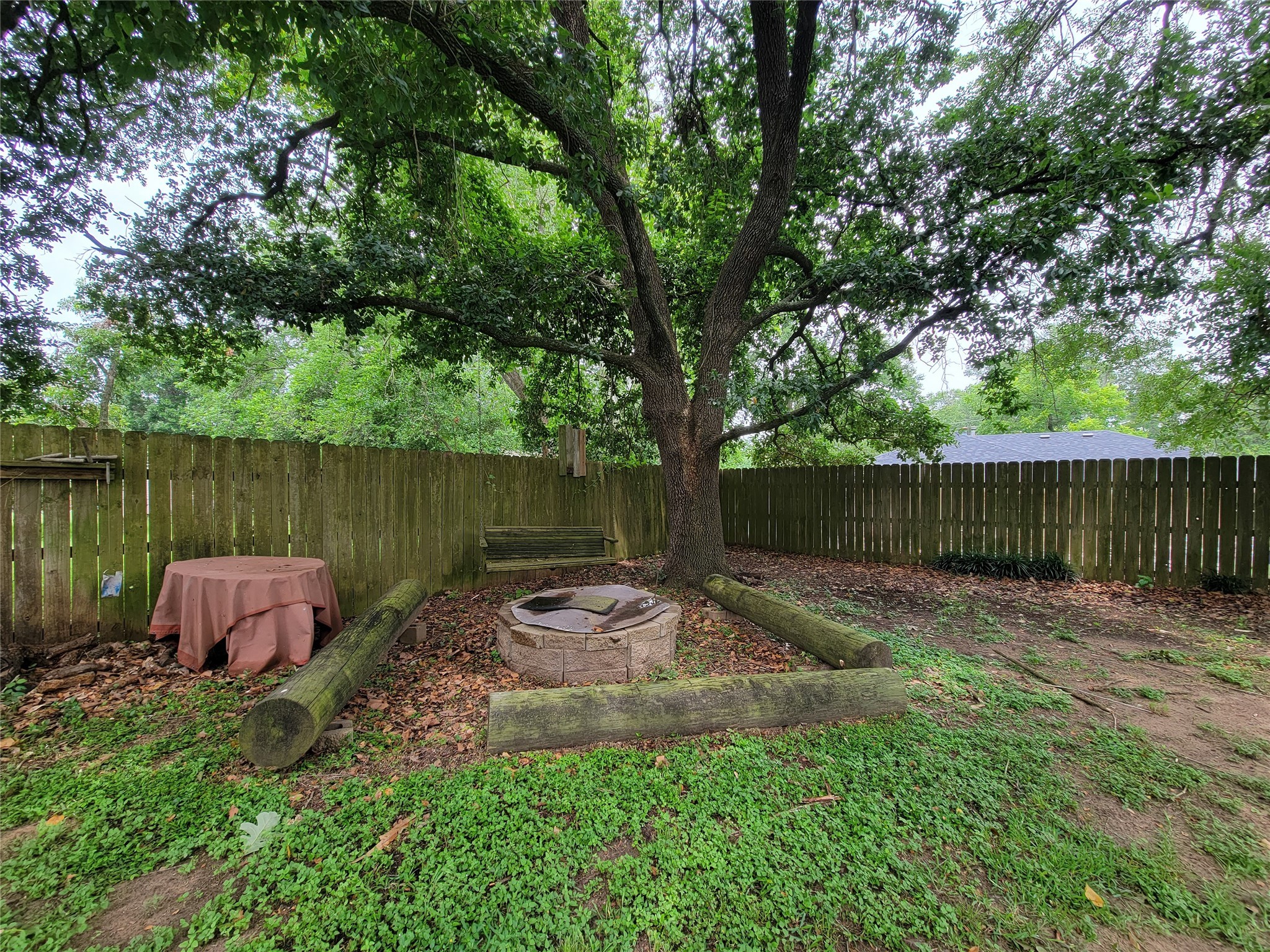 1406 Key Street Brenham, TX 77833 - Photo 37 of 50 a backyard of a house with outdoor seating