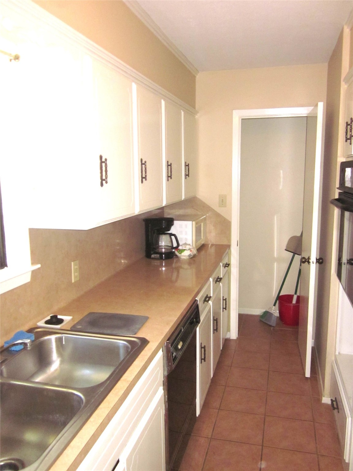 1406 Key Street Brenham, TX 77833 - Photo 43 of 50 a kitchen with a sink and cabinets