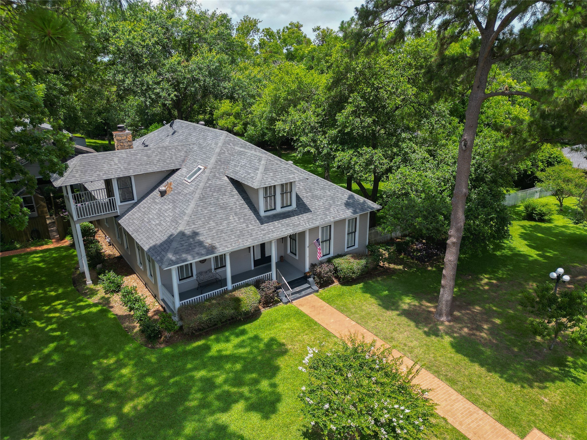 1406 Key Street Brenham, TX 77833 - Photo 49 of 50 an aerial view of a house with swimming pool next to a big yard