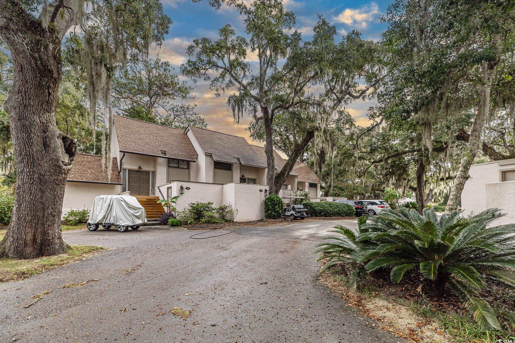30 Little Point Road, Unit 32 Georgetown, SC 29440 - Photo 6 of 30 View of front of home with roof with shingles and stucco siding